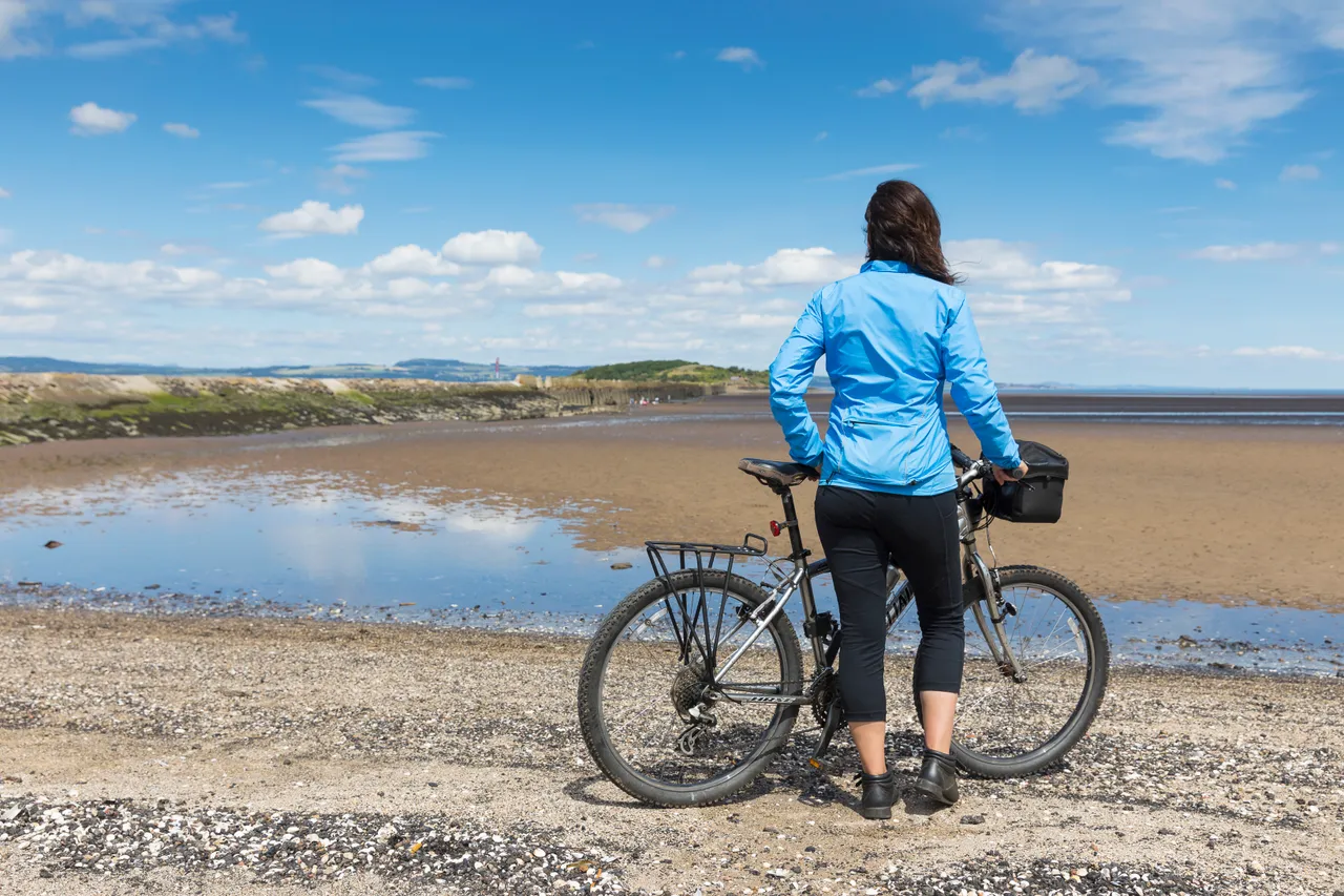 Cyclist on Cramond Beach