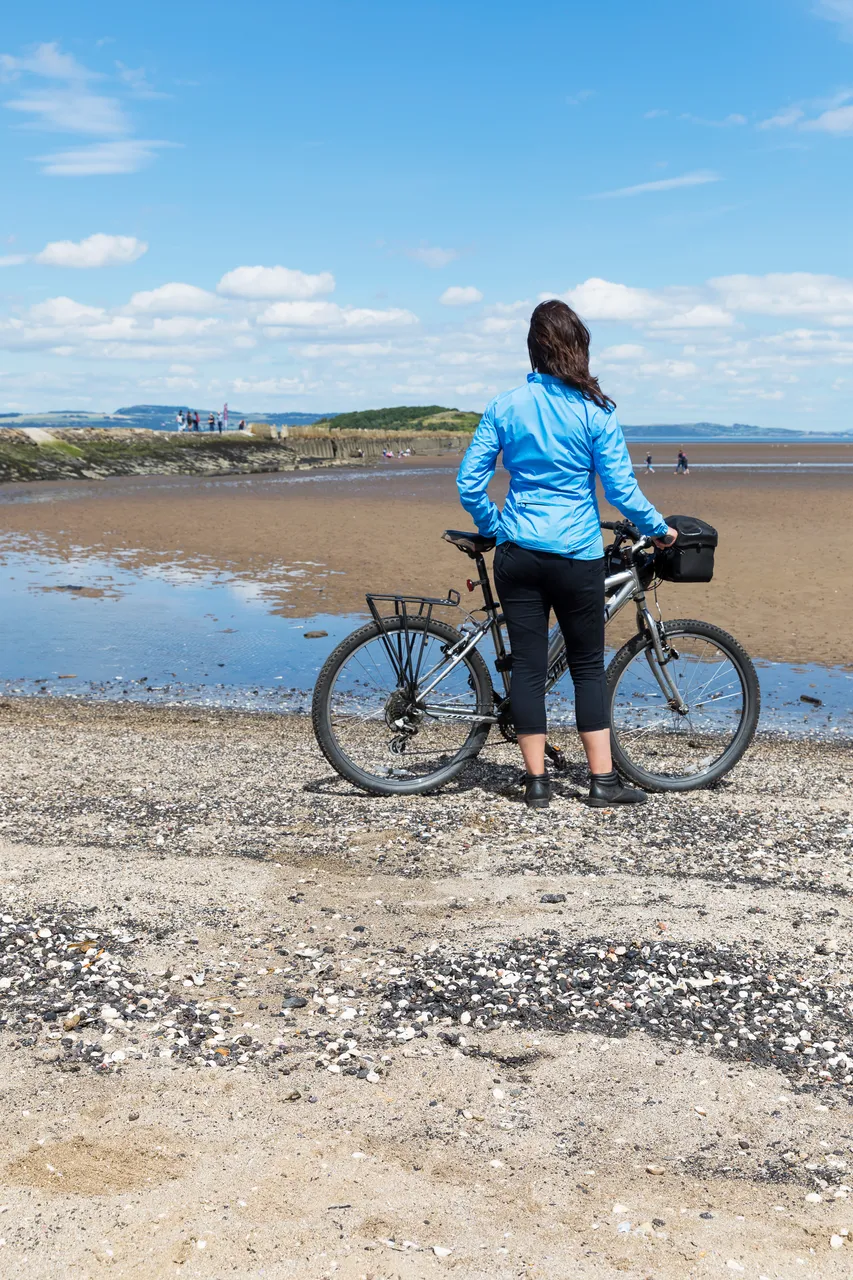 Cyclist on Cramond Beach