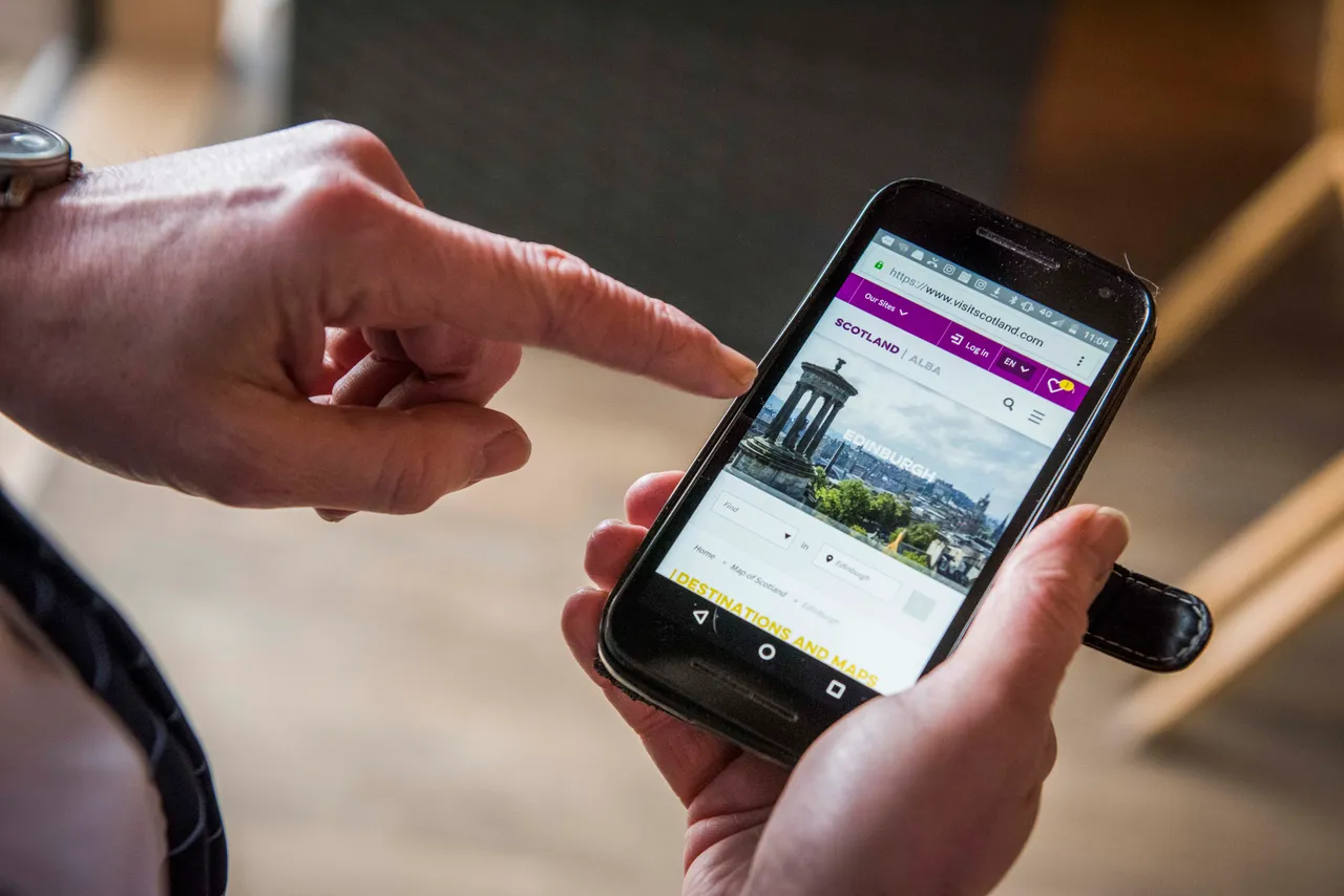 A man uses a smartphone