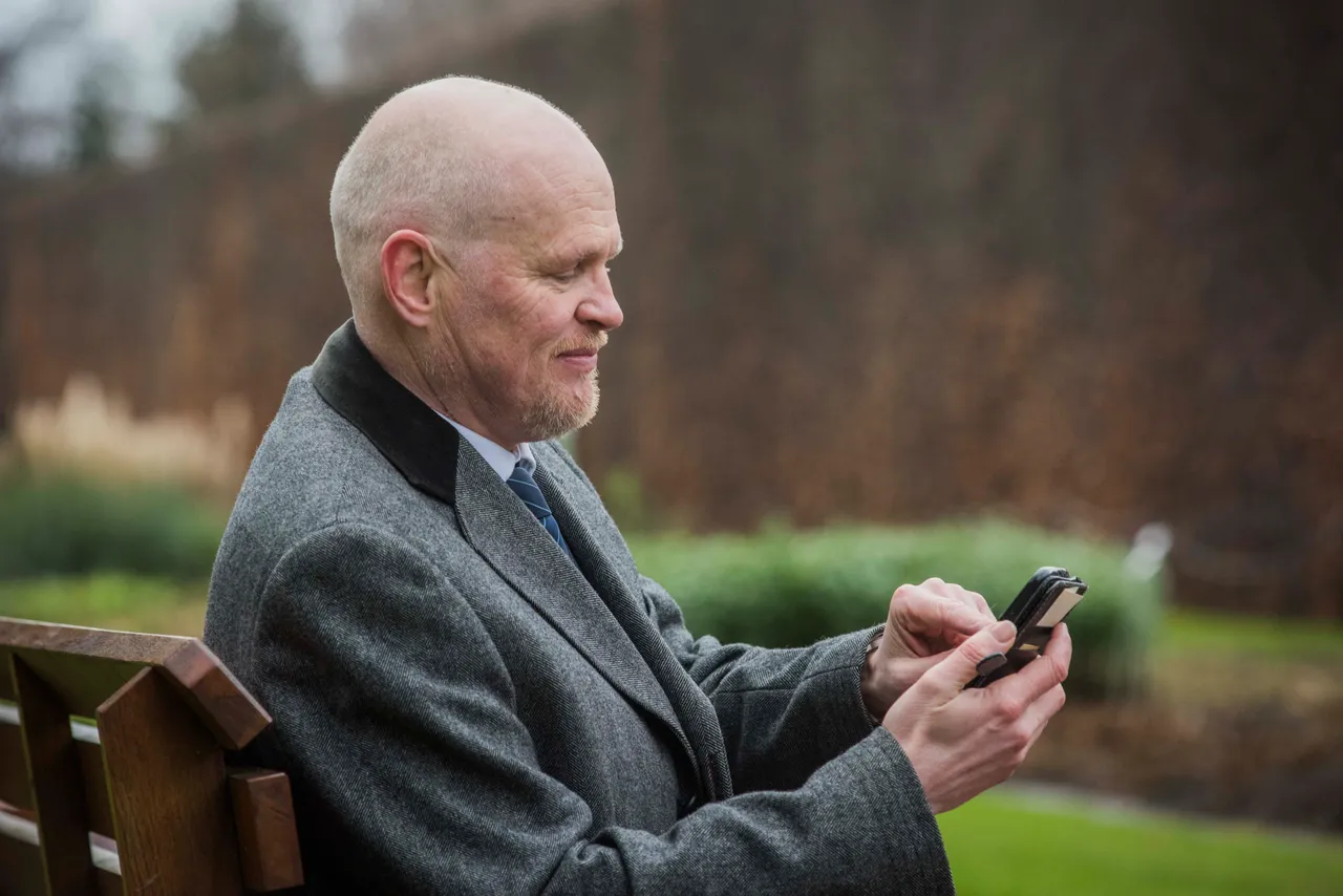 A man uses a smartphone