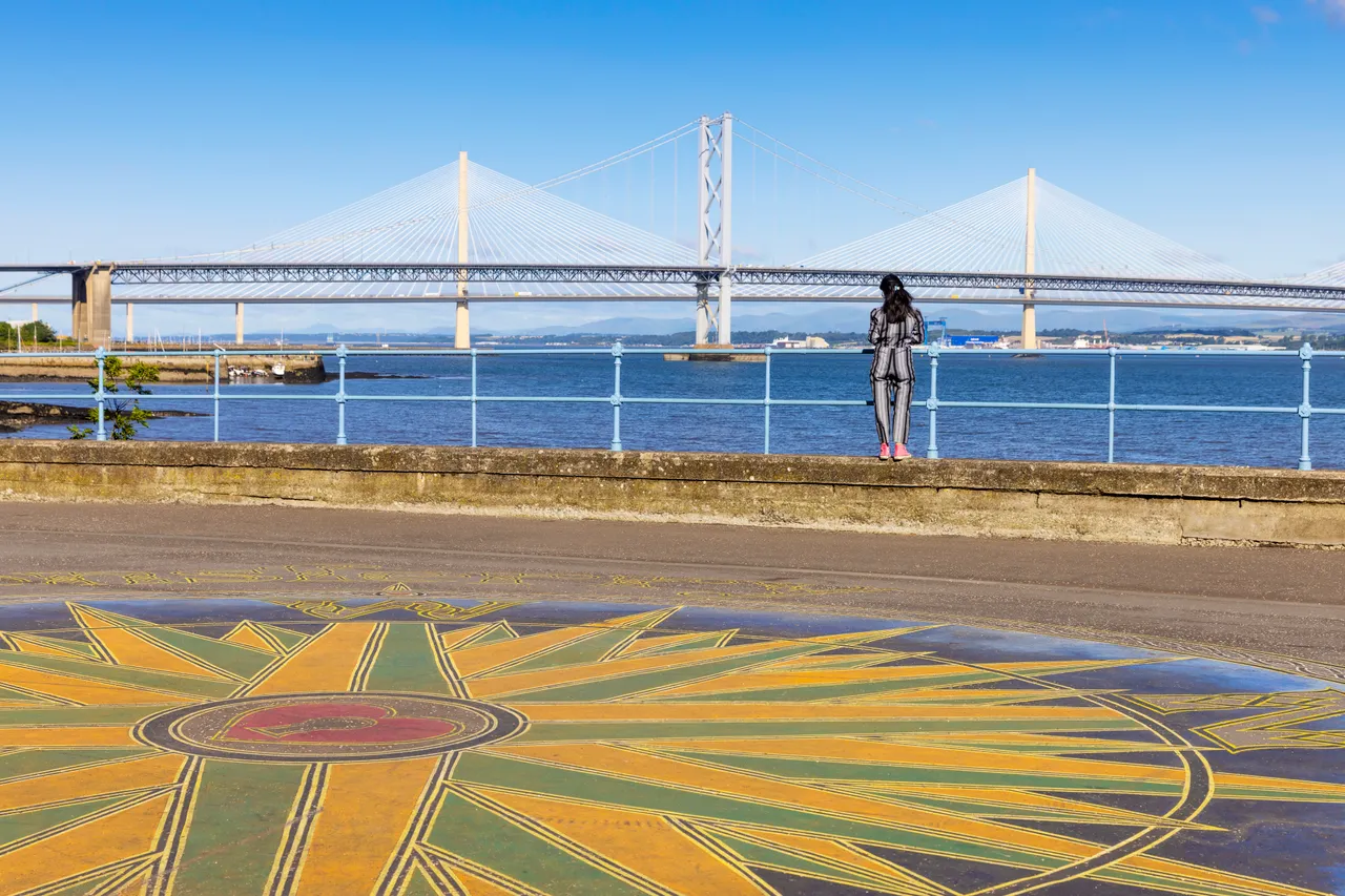 Victor Fraser’s 'Compass of the North’ artwork in South Queensferry with the Queensferry Crossing and Forth Road Bridge seen beyond