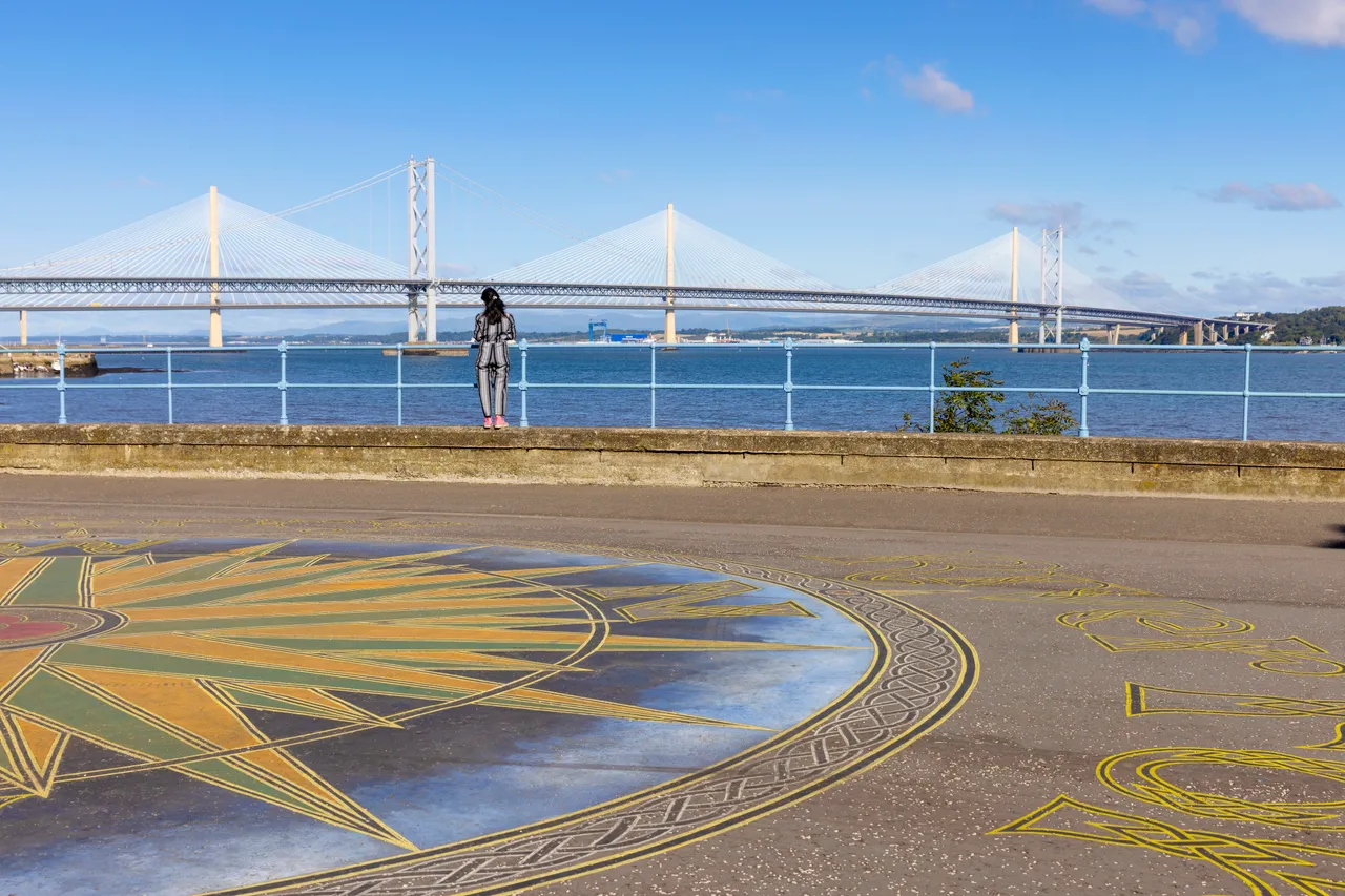 Victor Fraser’s 'Compass of the North’ artwork in South Queensferry with the Queensferry Crossing and Forth Road Bridge seen beyond