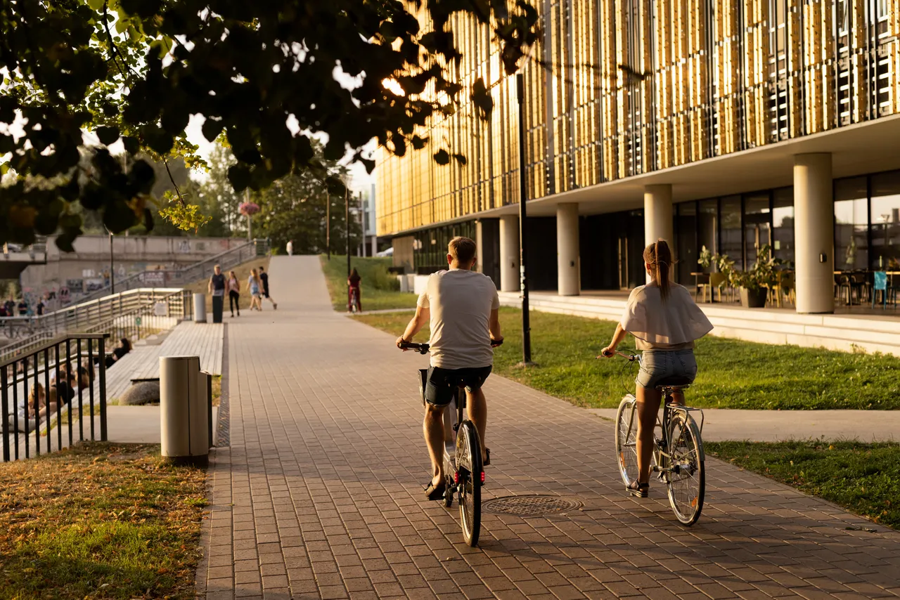 Man and woman riding bicycles in the city