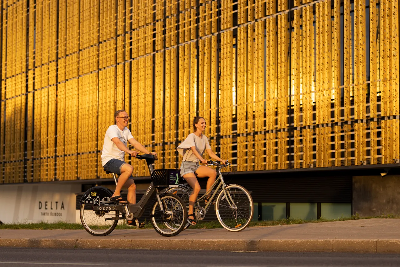 Man and woman riding bicycles in the city