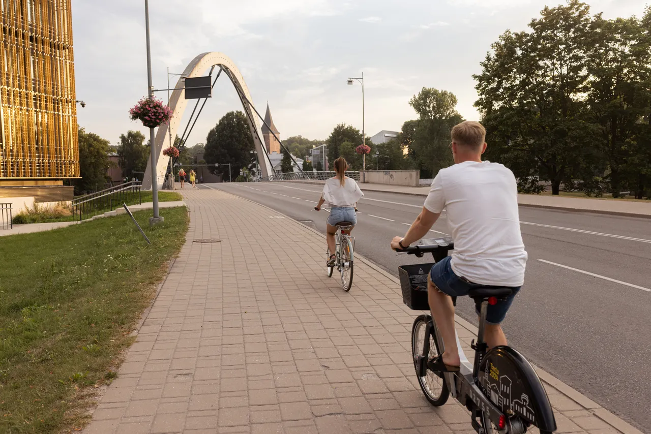 Man and woman riding bicycles in the city