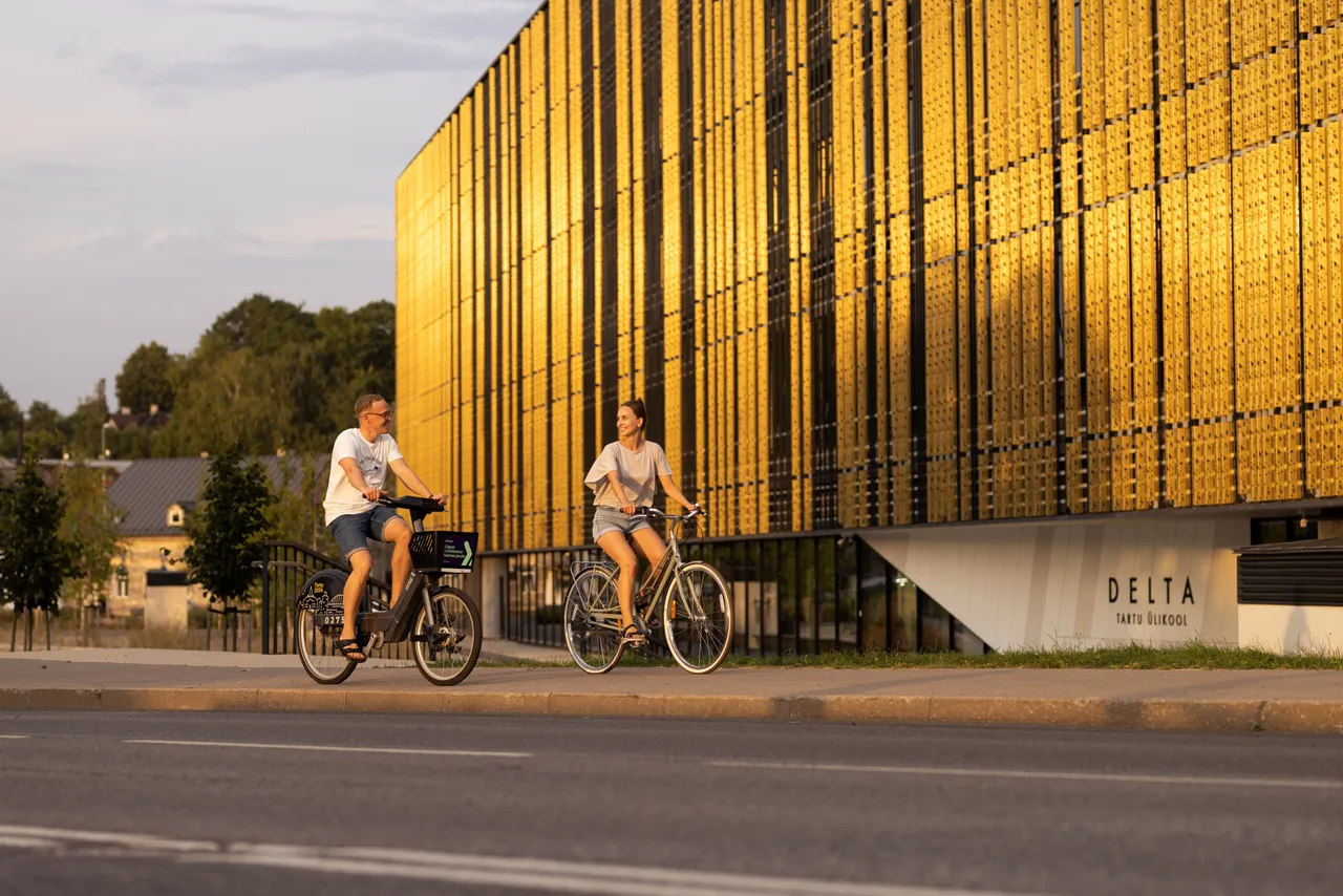 Man and woman riding bicycles in the city