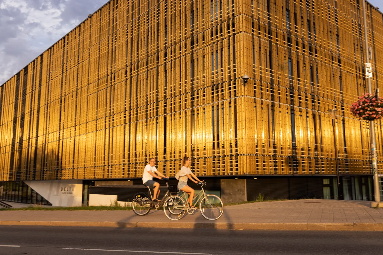 Man and woman riding bicycles in the city