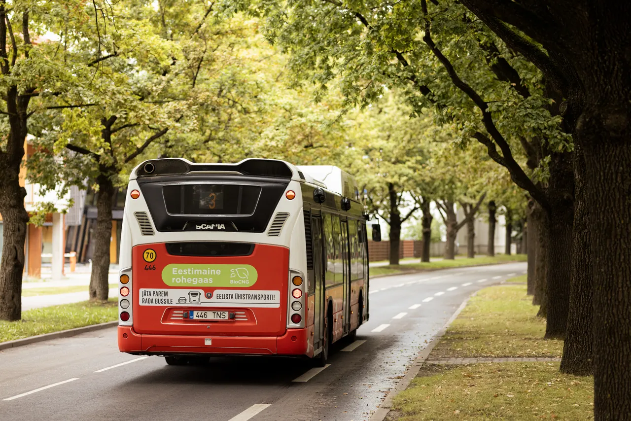 Biogas bus driving on city street