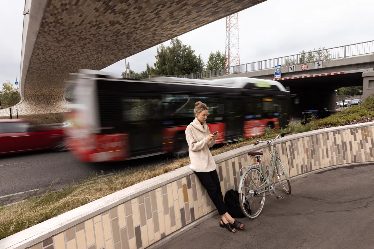 Biogas bus driving on city street
