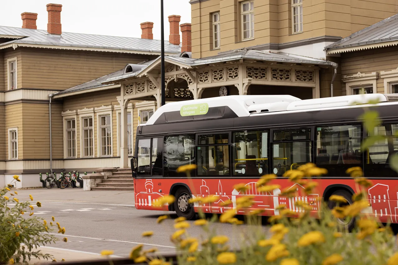 Biogas bus driving on city street