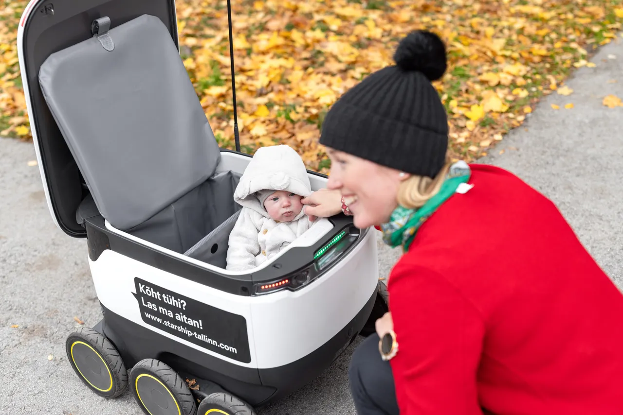 Woman, baby and a Starship robot