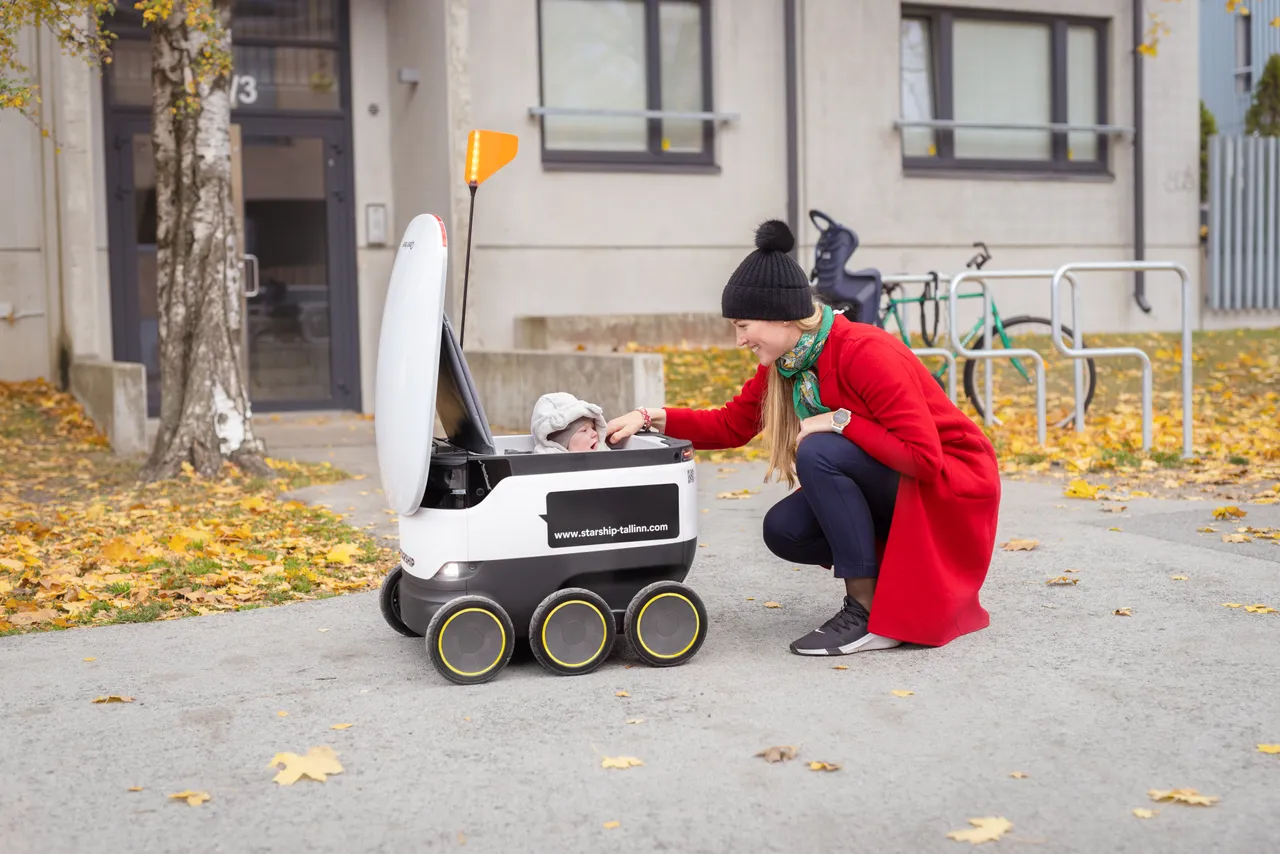 Woman, baby and a Starship robot