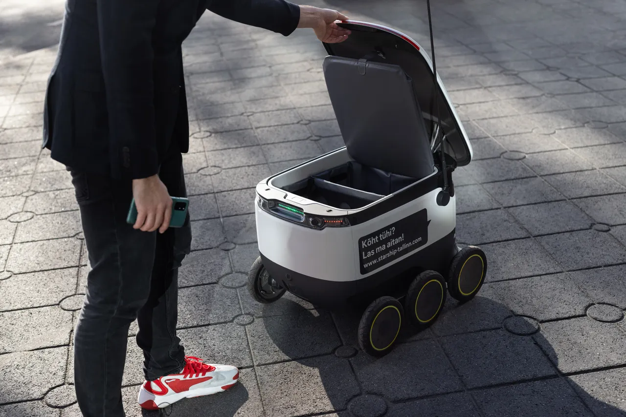 Man using Starship delivery robot