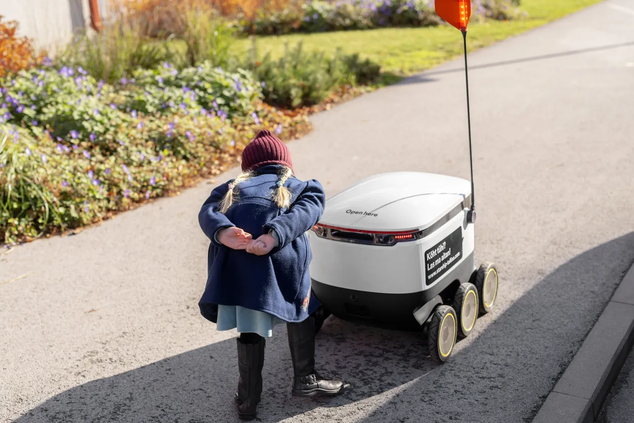 Child and a Starship delivery robot