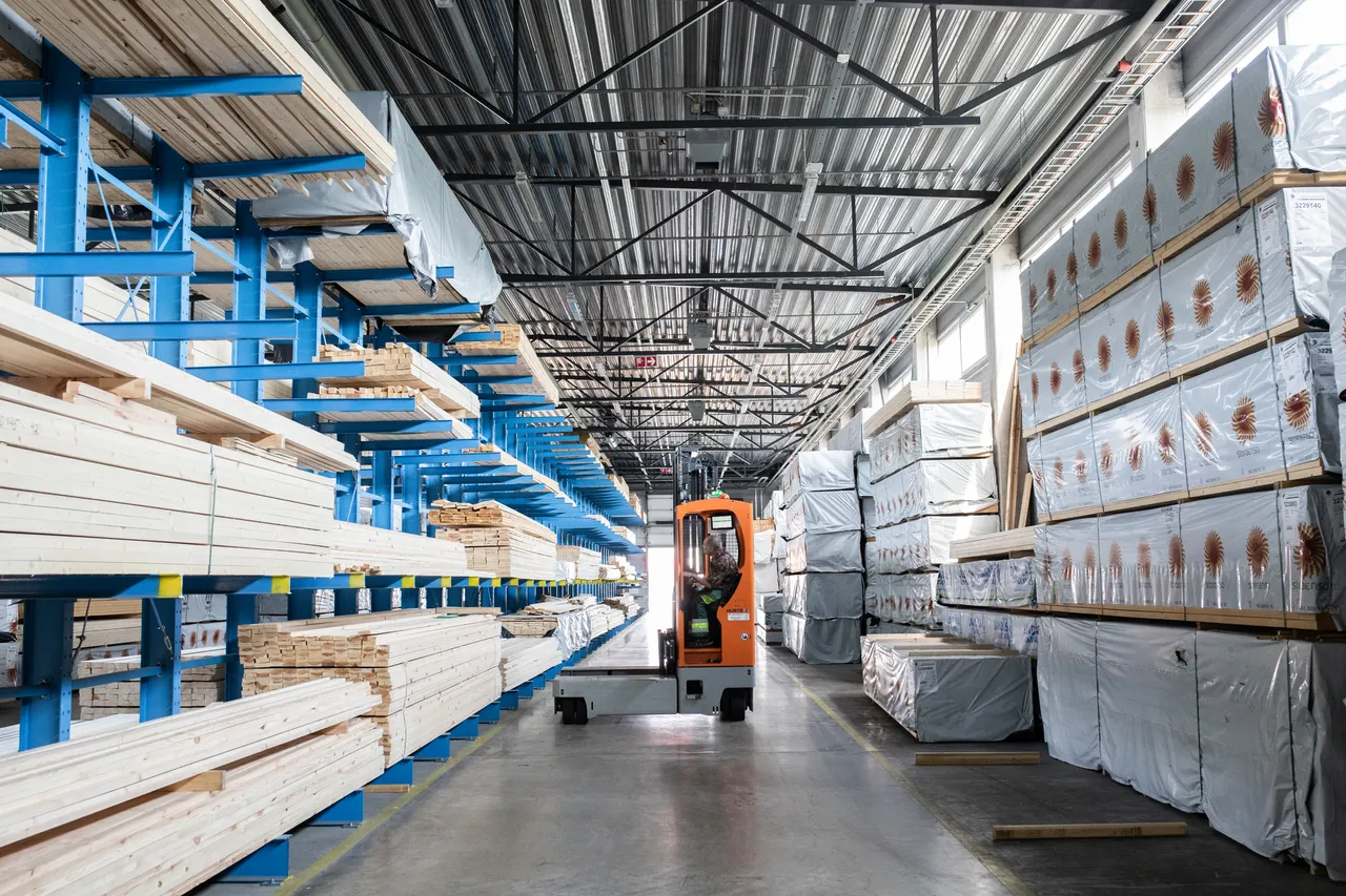 Forklift working in timber warehouse