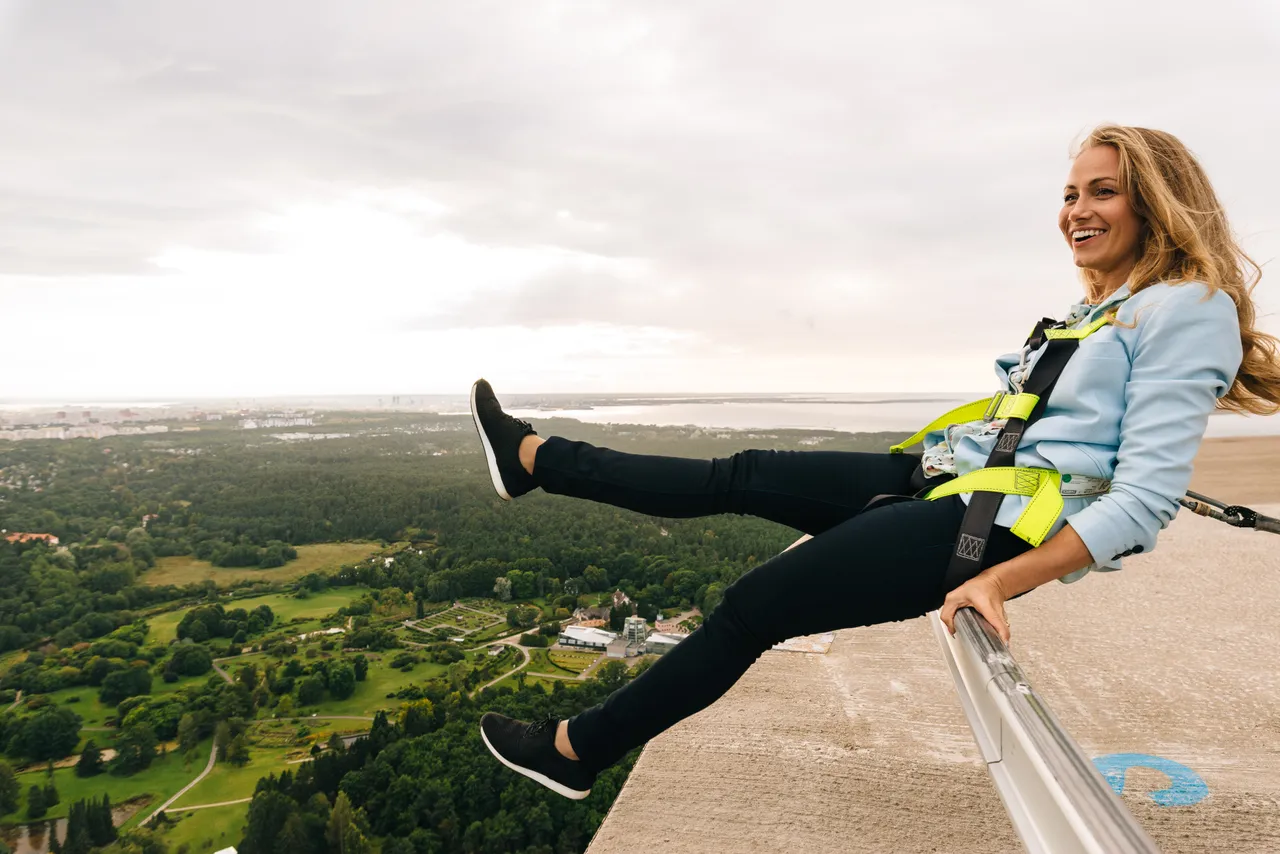 A Woman doing Tallinn TV Tower Edge walk
