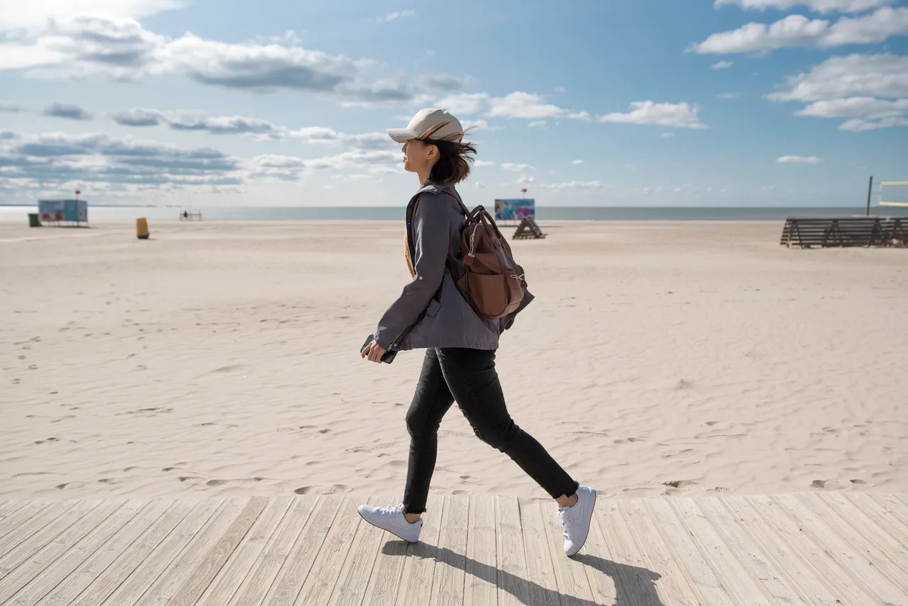 Woman walking on beach