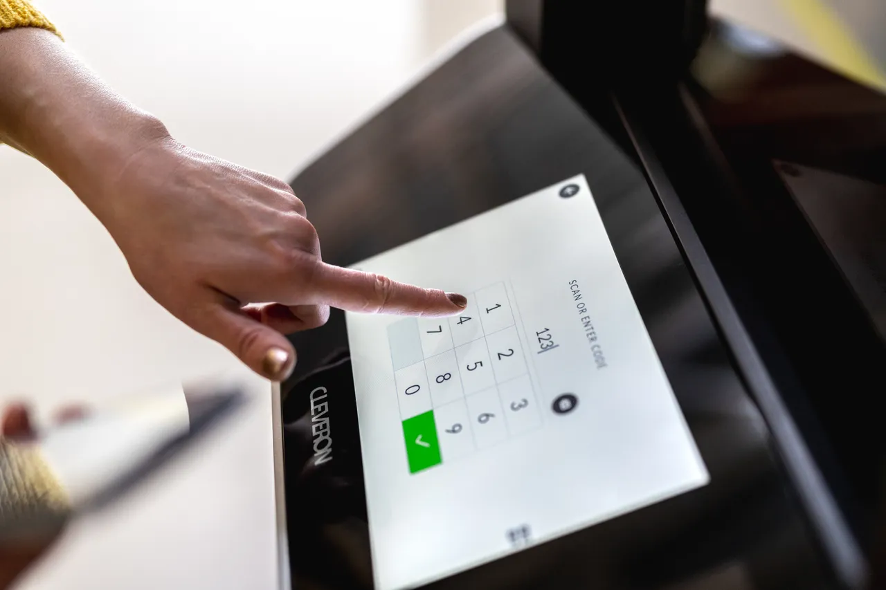 Woman using pack robot touch pad