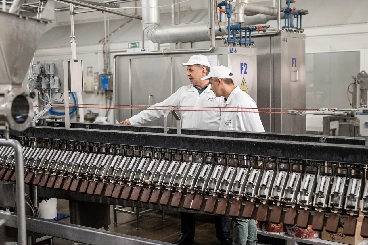 Two men at ice cream production