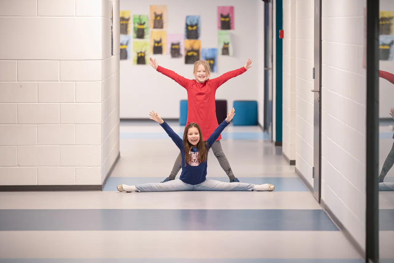Two girls at school hallway
