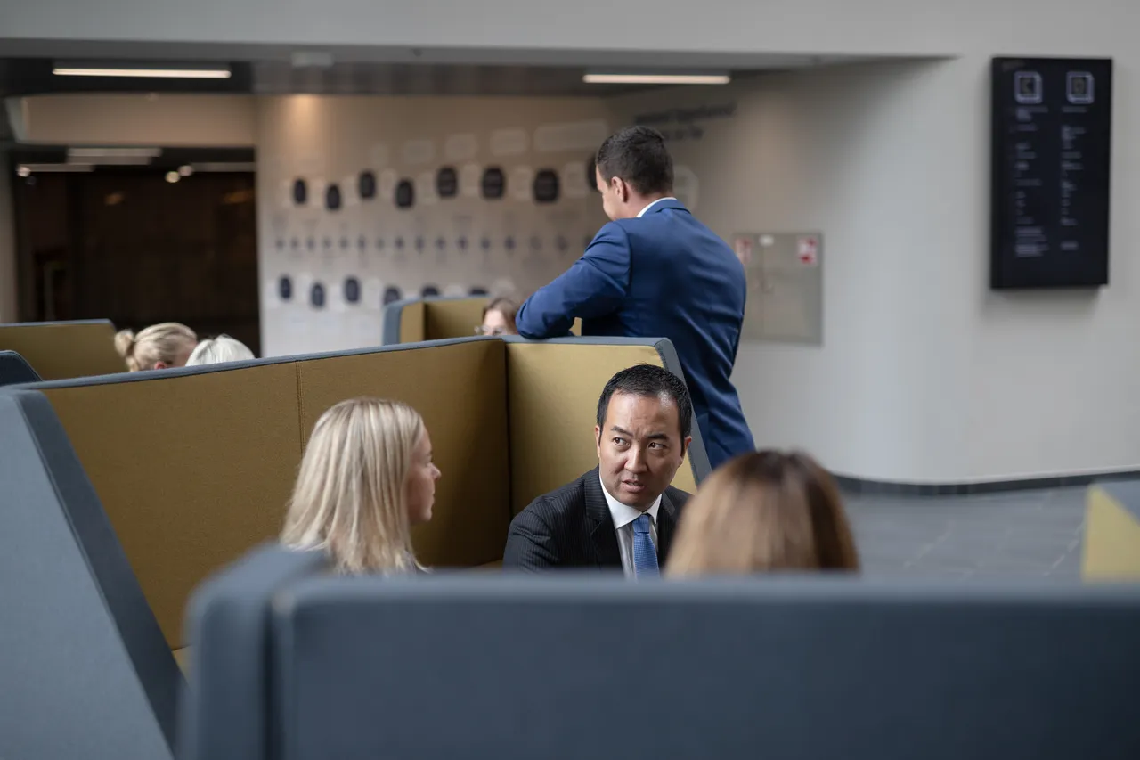 Group of business people sitting and talking