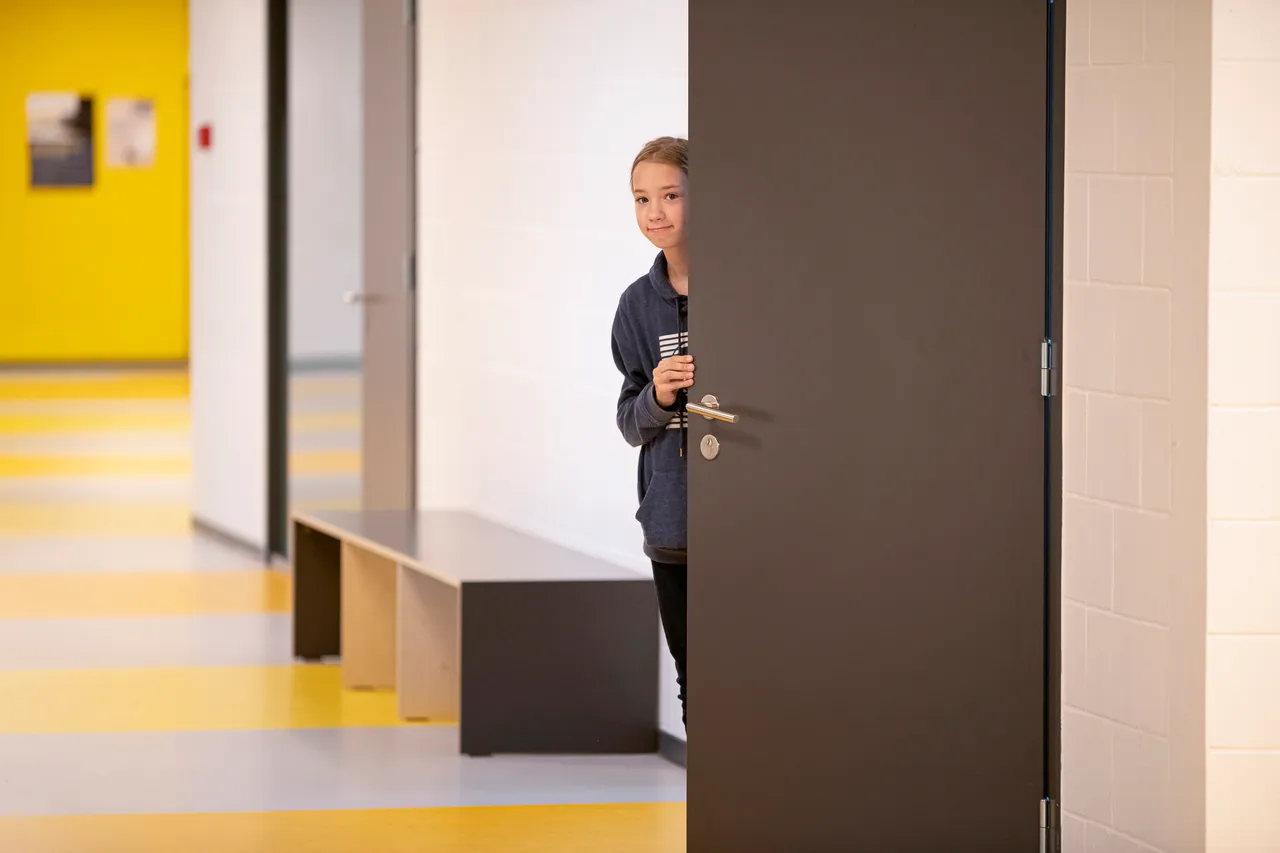 Girl peeking at school