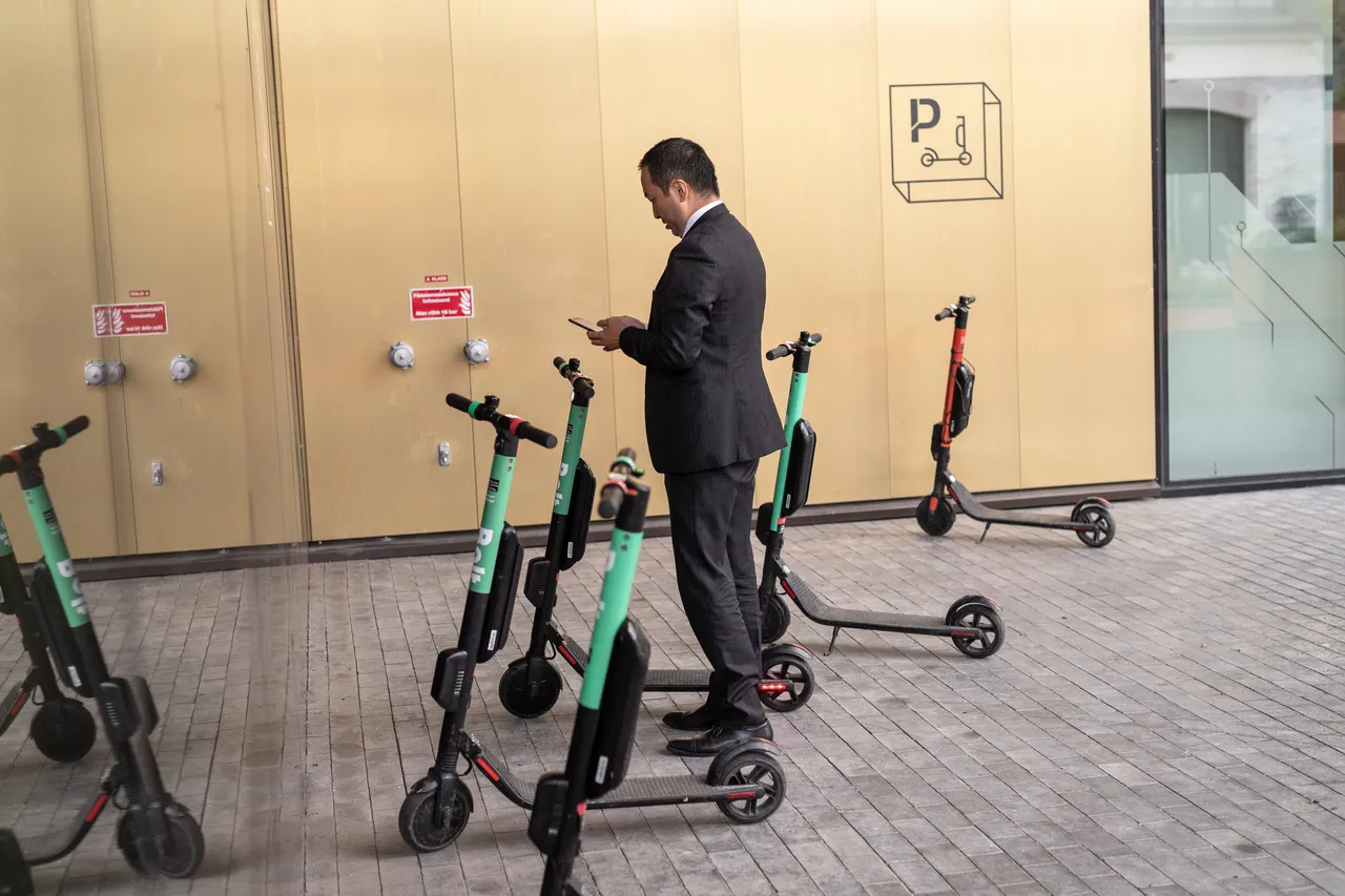 Man scanning electric scooter