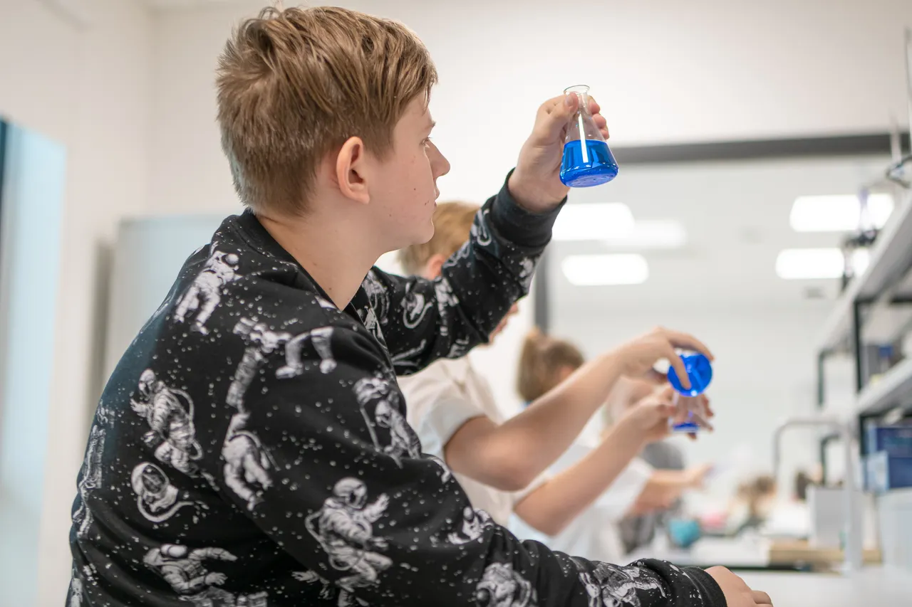 Kids at chemistry class