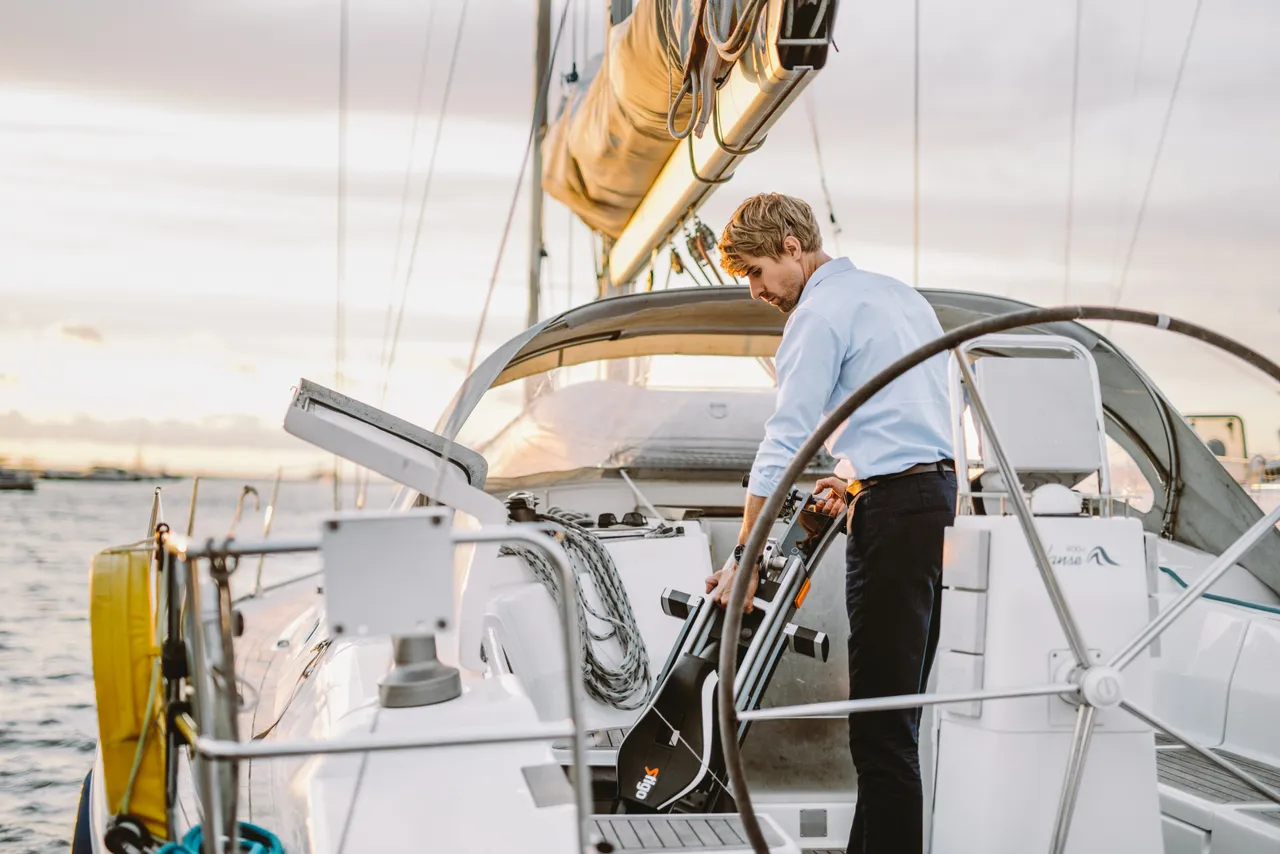 Man on a sailing boat with bike