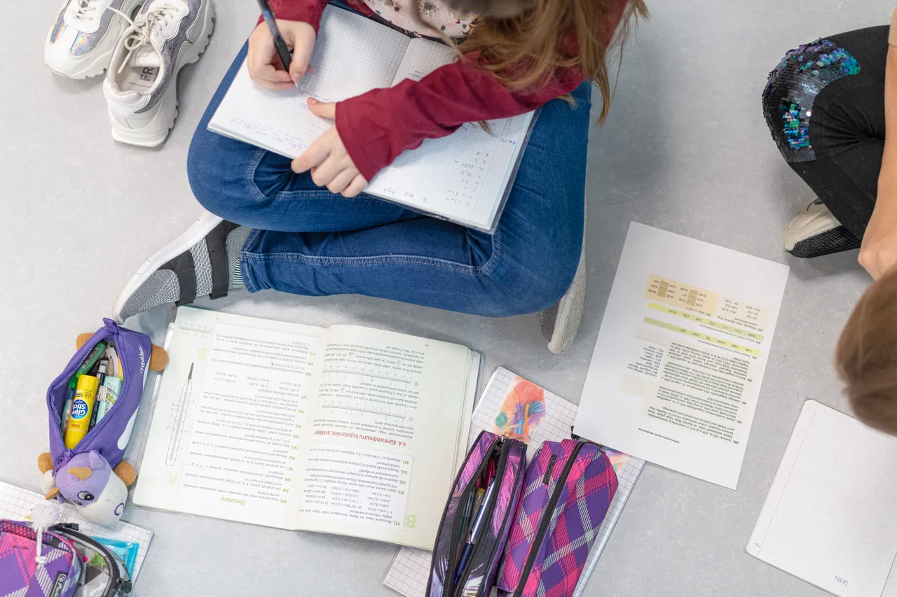 Children writing in classroom