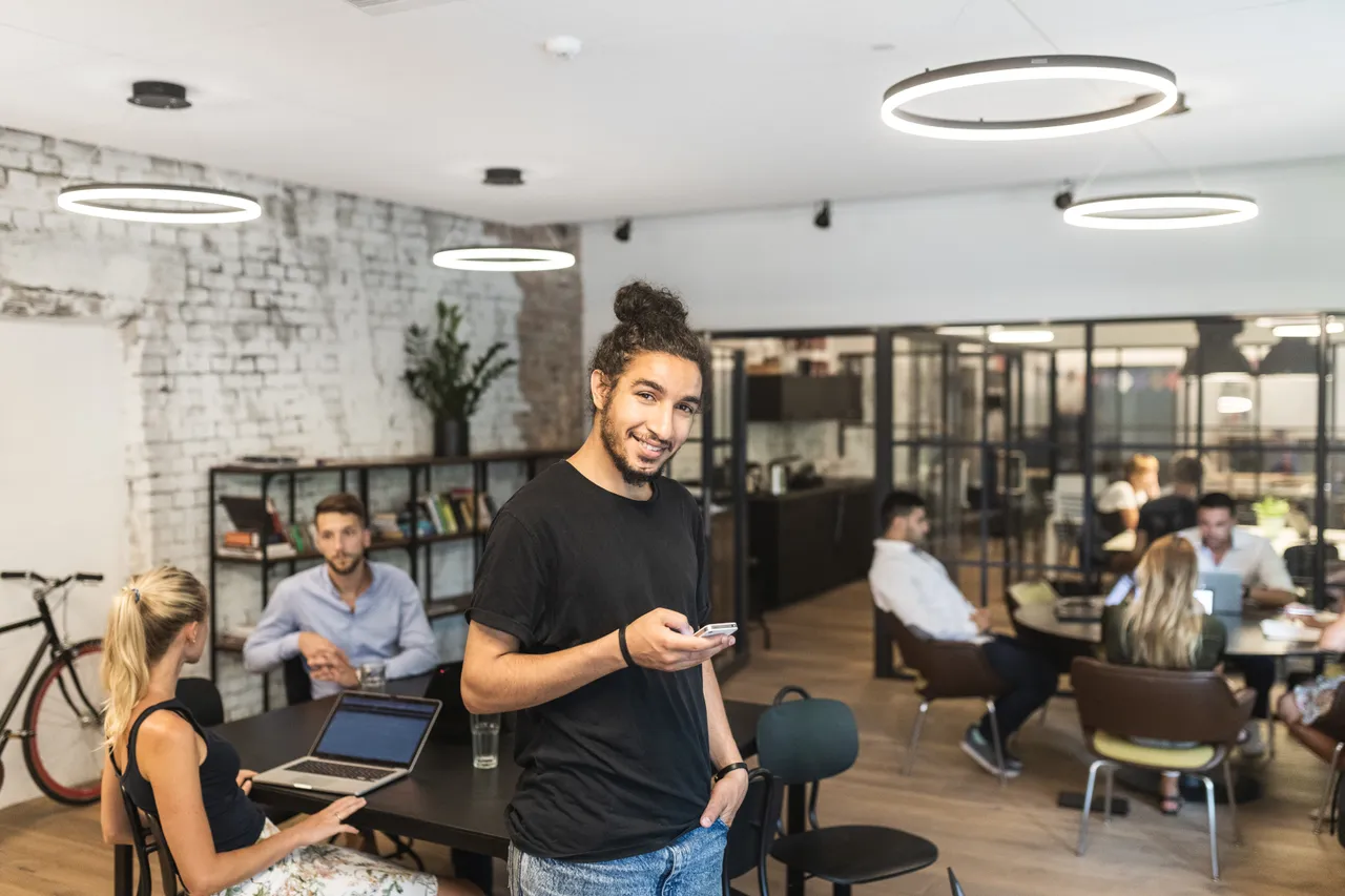 Man in office with phone
