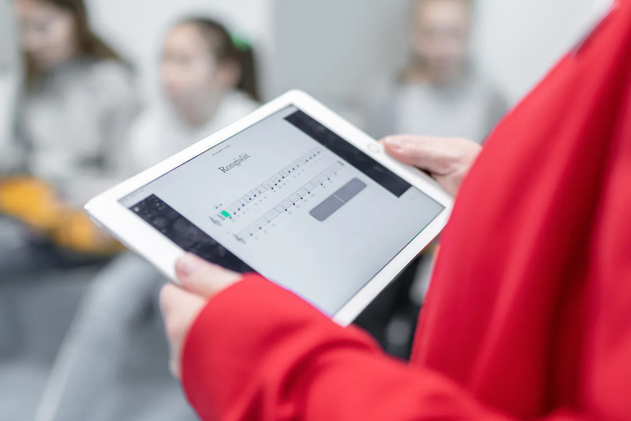 Children singing from tablet