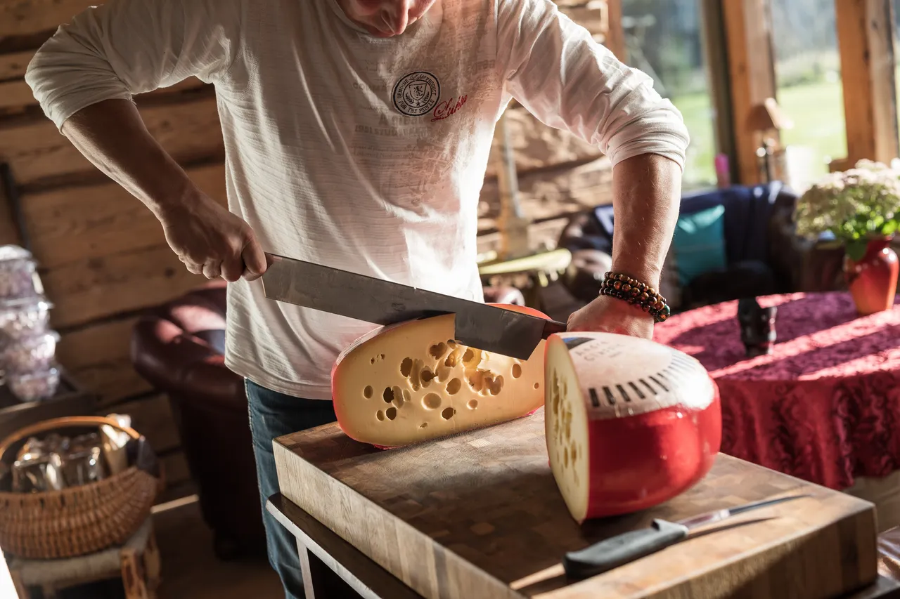 Cheesefarm cutting cheese