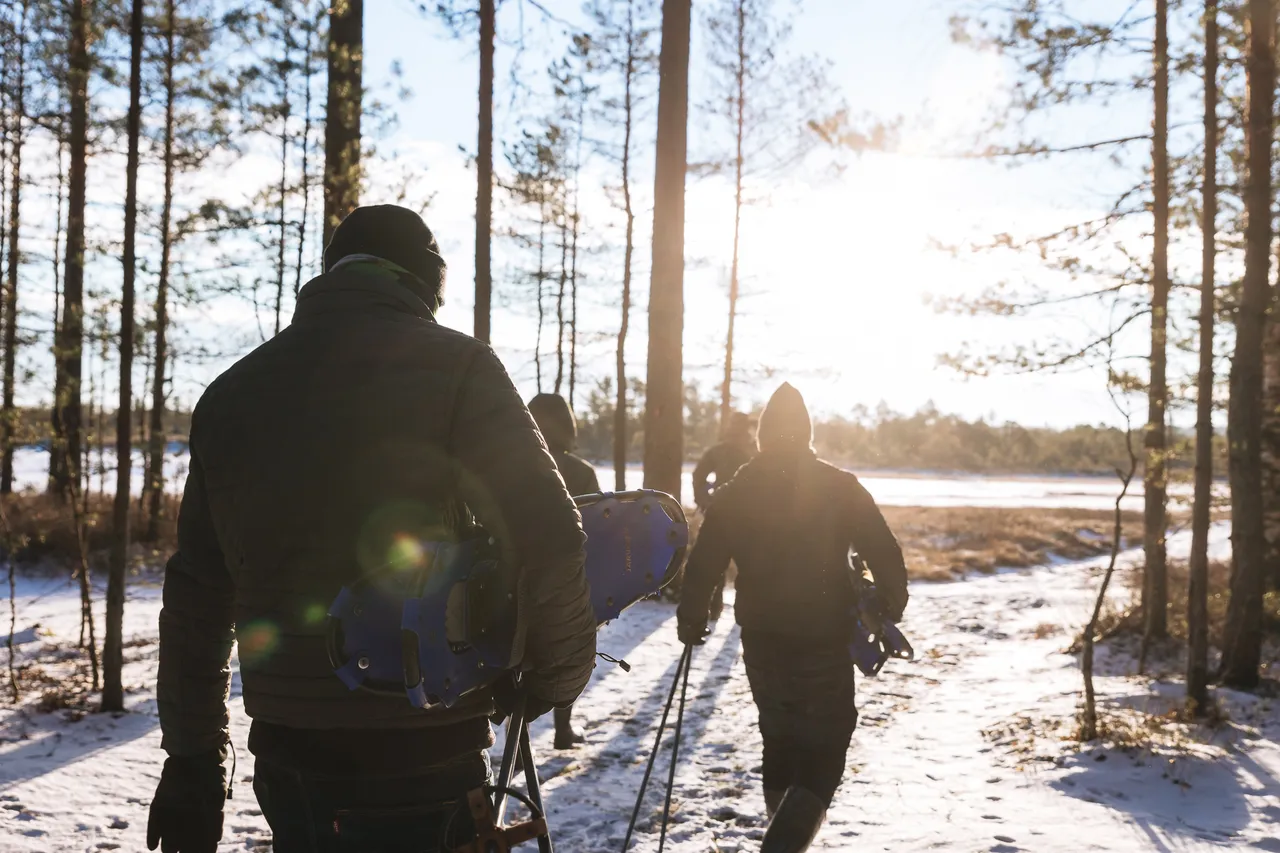 Group of people going hiking in winter