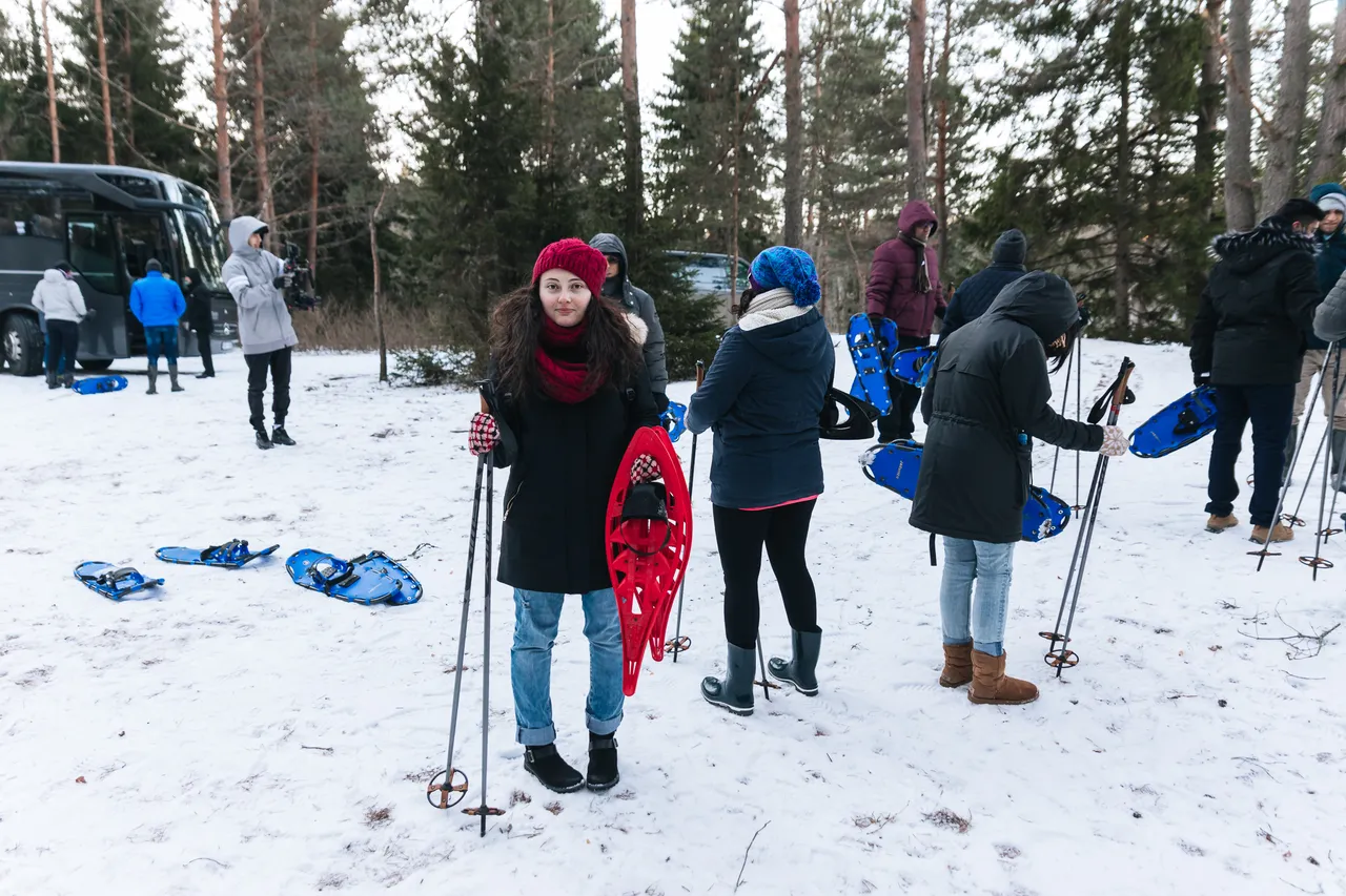 Group of people going hiking in winter