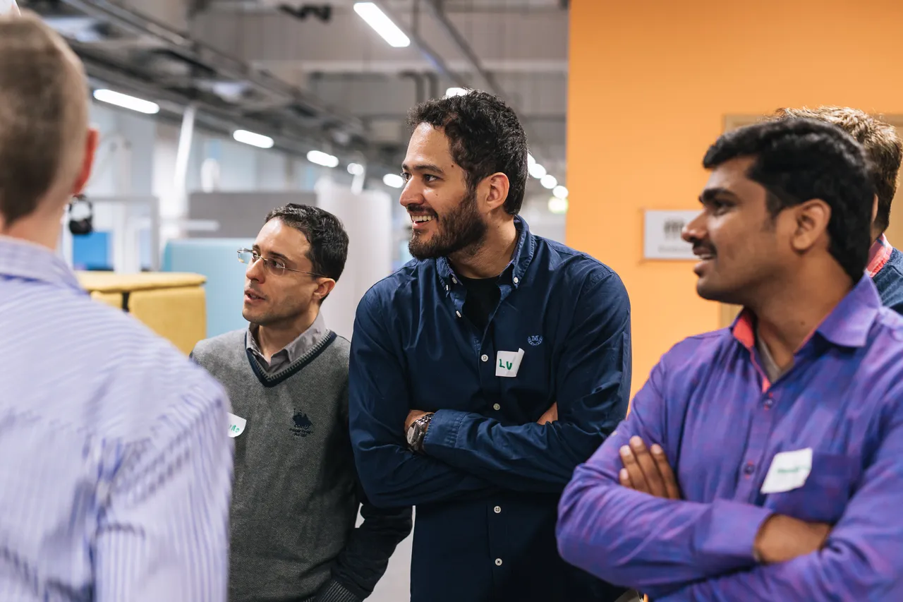 Group of men having a chat in office