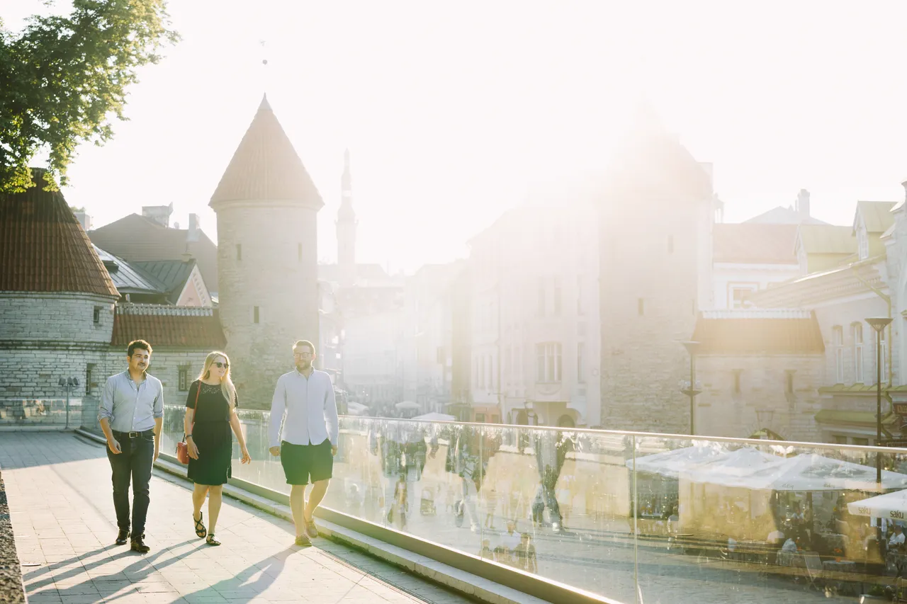Friends walking in Tallinn Old town