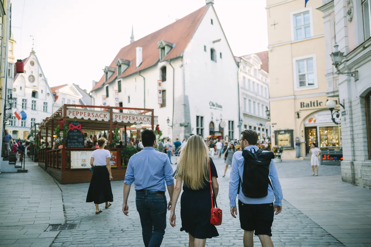 Friends walking in Tallinn Old town Viru street