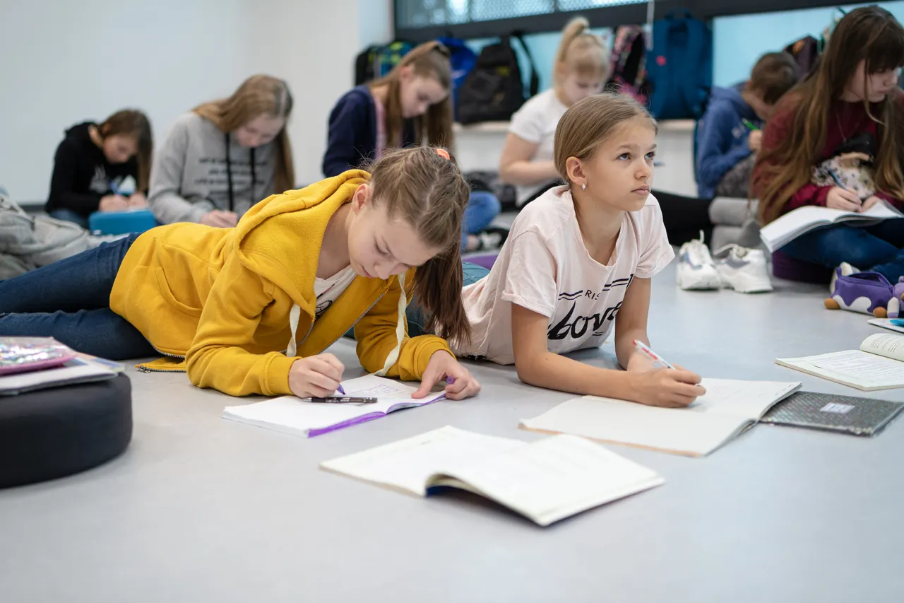 Children writing tasks in classroom