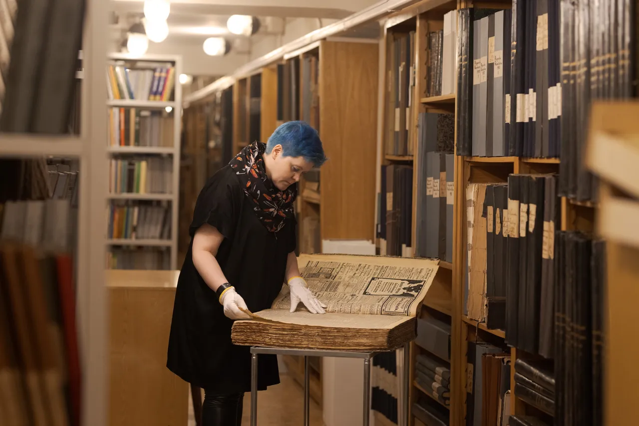 Woman in the library archives
