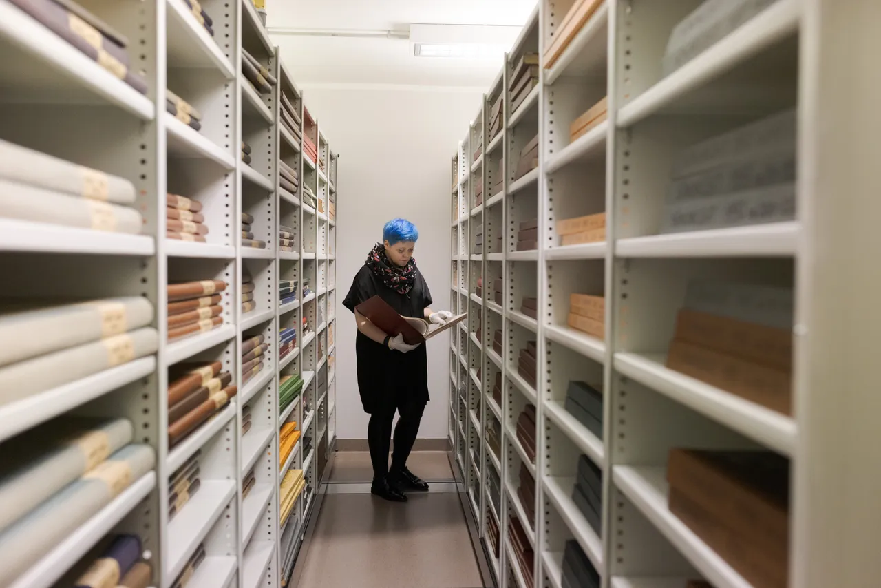 Woman in the library archives