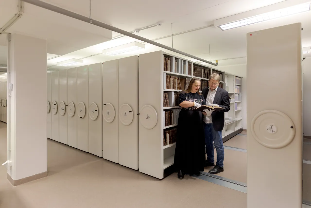 Researchers in museum archive