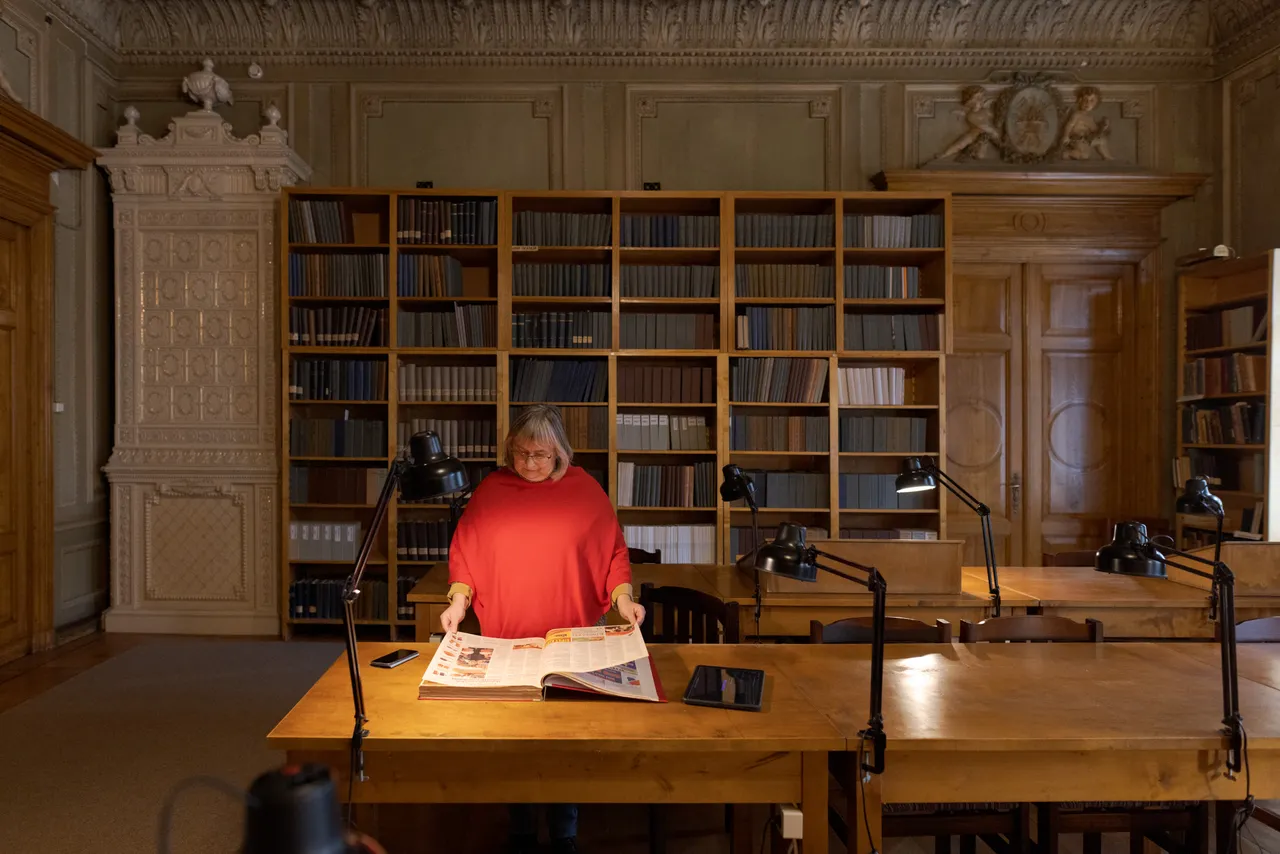 Female researcher in archival library