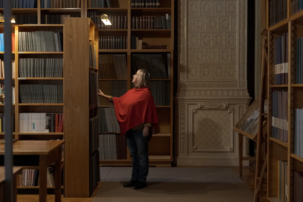 Female researcher in archival library