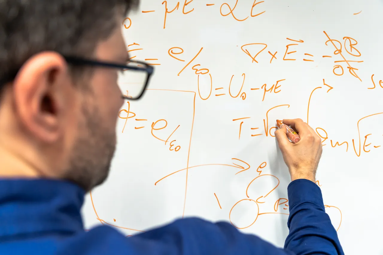 Man drawing on board