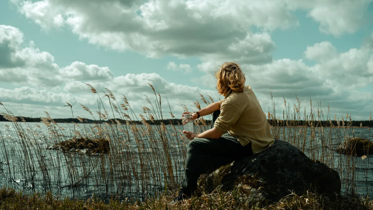 Man drinking birch sap