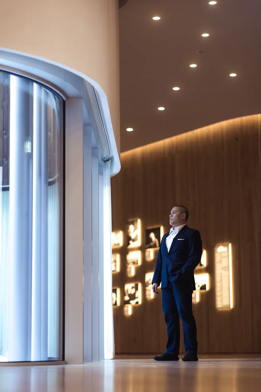 Man standing in modern wooden interior