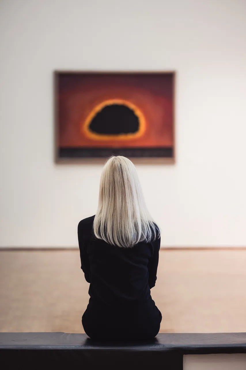 Woman looking at painting