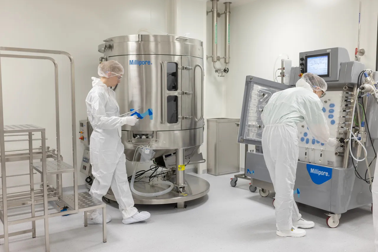 Lab workers at equipment