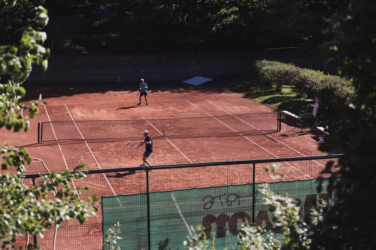 Men playing tennis